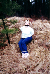 Sitting tied  on ground