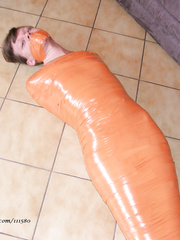 Wendy's mummification in tight orange tape