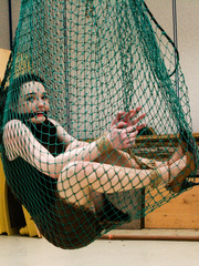 Pretty brunette caught in a net