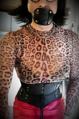 Dildo gagged in corset