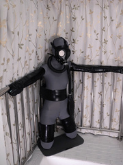 Girl in leather and tape bondage