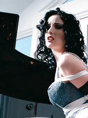 Bound and gagged in piano studio.