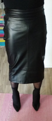Leather skirt with high heels and pantyhoses