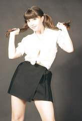 Rosaleen Young in white blouse and black skirt