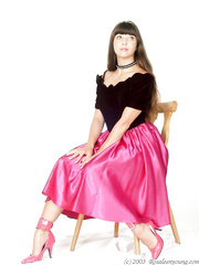 Rosaleen Young tied and gagged in fuchsia skirt