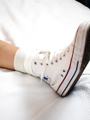 Tied to bed in converse