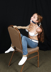 Blue jeans, bra, and white socks