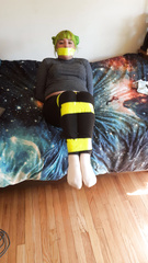 Green haired girl taped up.